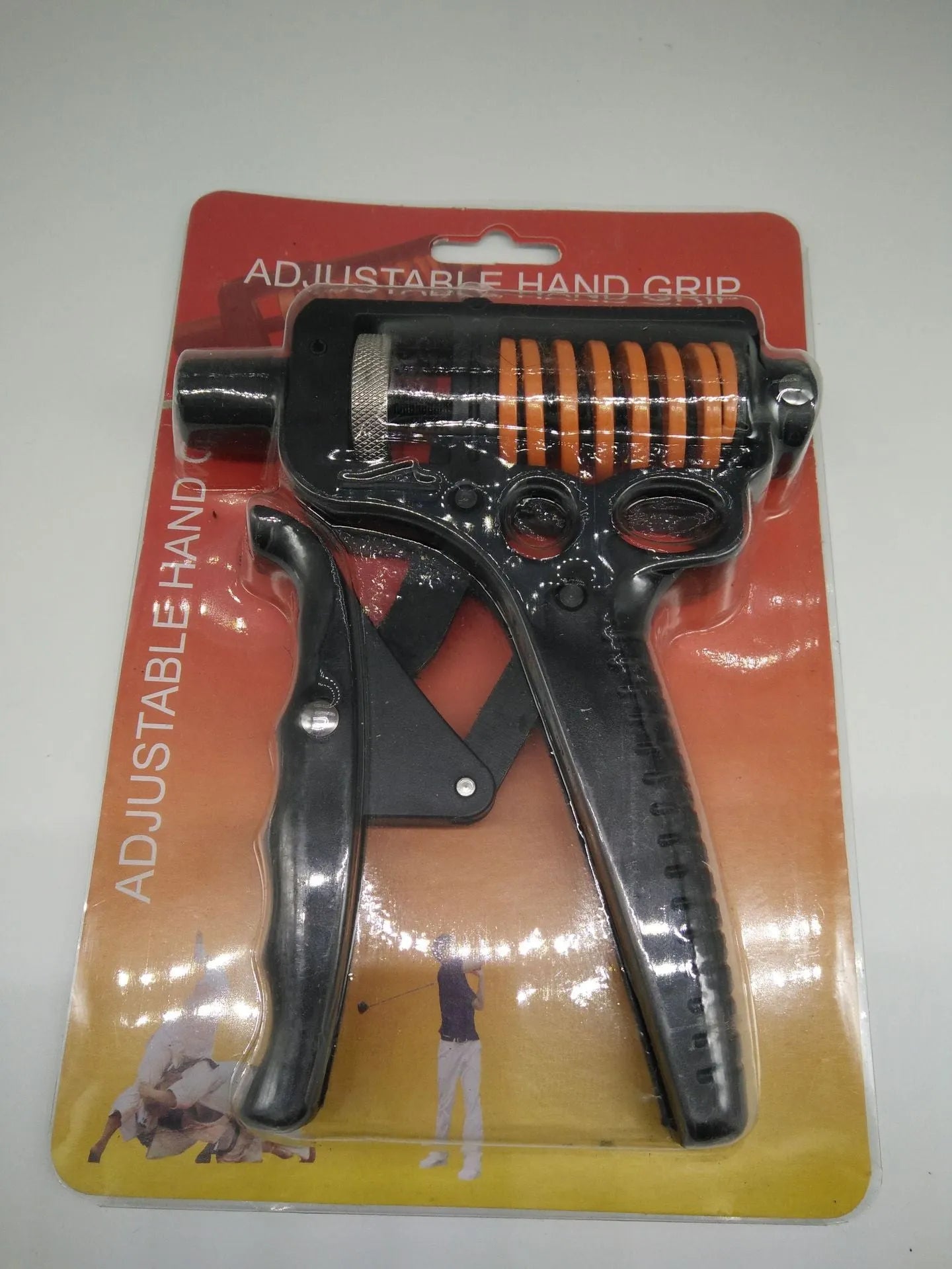 Black adjustable finger trainer grip strength exerciser with ABS and metal construction on a plain background