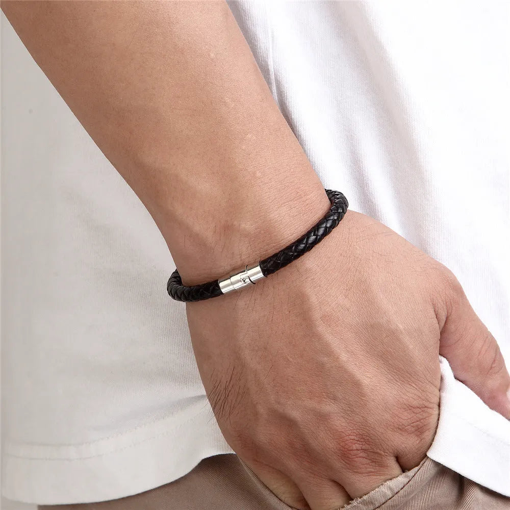 Geometric titanium steel bracelet with a magnetic clasp, shown in a unisex style.