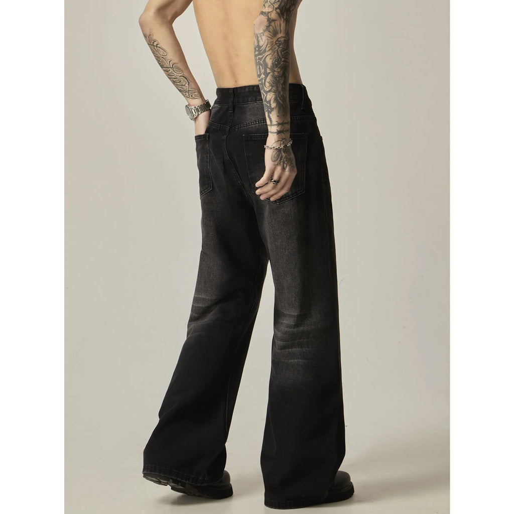 Black loose-fit straight-leg men's jeans with a zipper fly and retro styling.