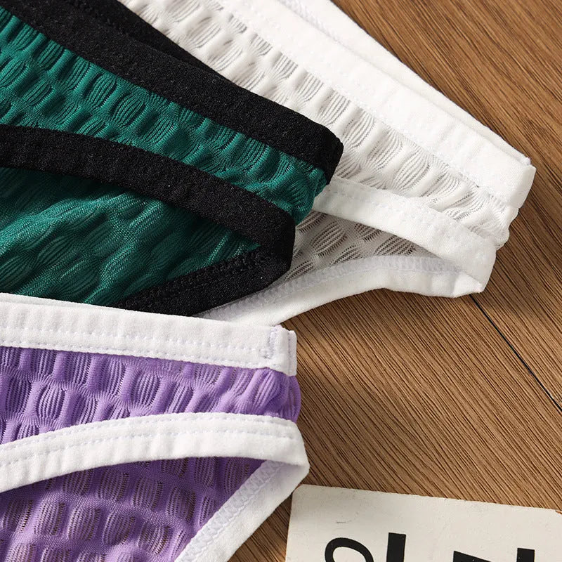 Men's low waist transparent lace underwear in a choice of colours on a size chart.