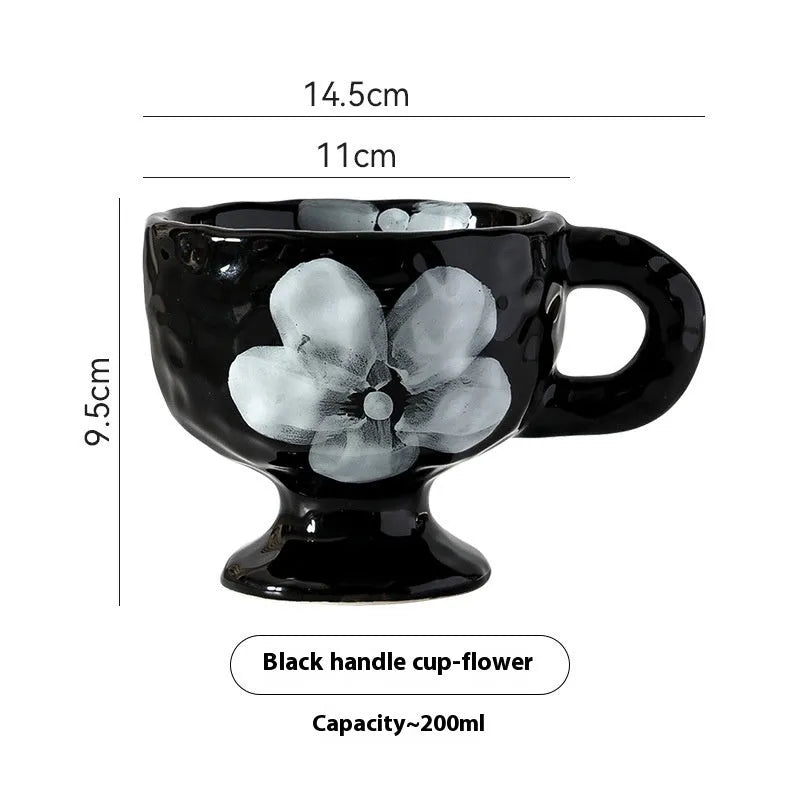 Hand-pinched irregular ceramic mug in solid colour with modern design