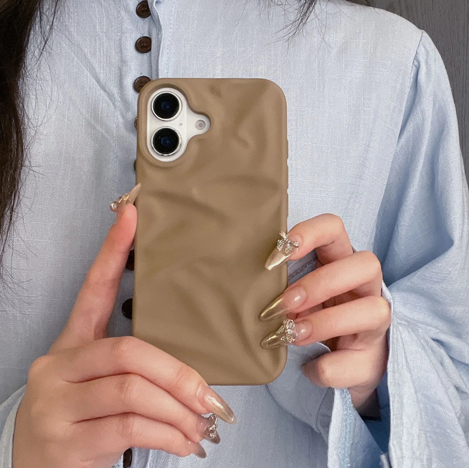 High-grade three-dimensional pleated pattern silicone phone case for iPhone 17 series in black, soft shell construction with fall protection