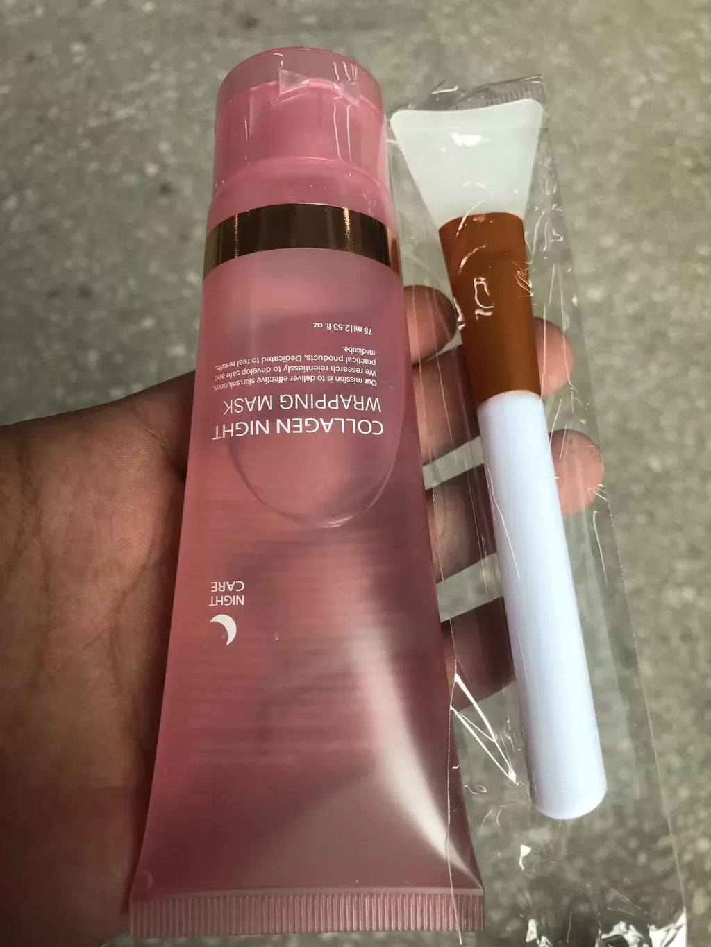 75ml bottle of collagen night face mask with an application brush on a white background.