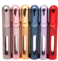 A slim, portable 12ml aluminium perfume bottle with a glass liner in choice of colours including blue, golden, pink, red, silvery, and violet.