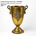 Metal decorative vase with black and gold finish, modern simplicity design on a tabletop