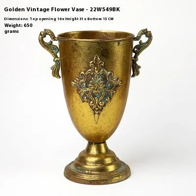 Metal decorative vase with black and gold finish, modern simplicity design on a tabletop