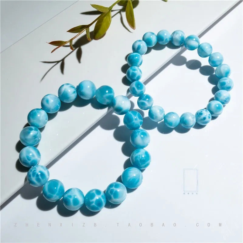 Blue bodhi bracelet with natural crystal sea-pattern stone and pearl accents in Maillard style arrangement