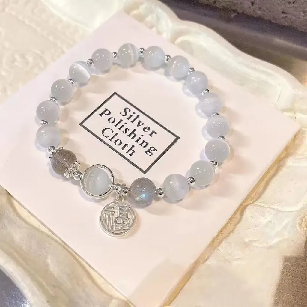 Glass butterfly bracelet for women with colour-coordinated beads in drop-shaped design
