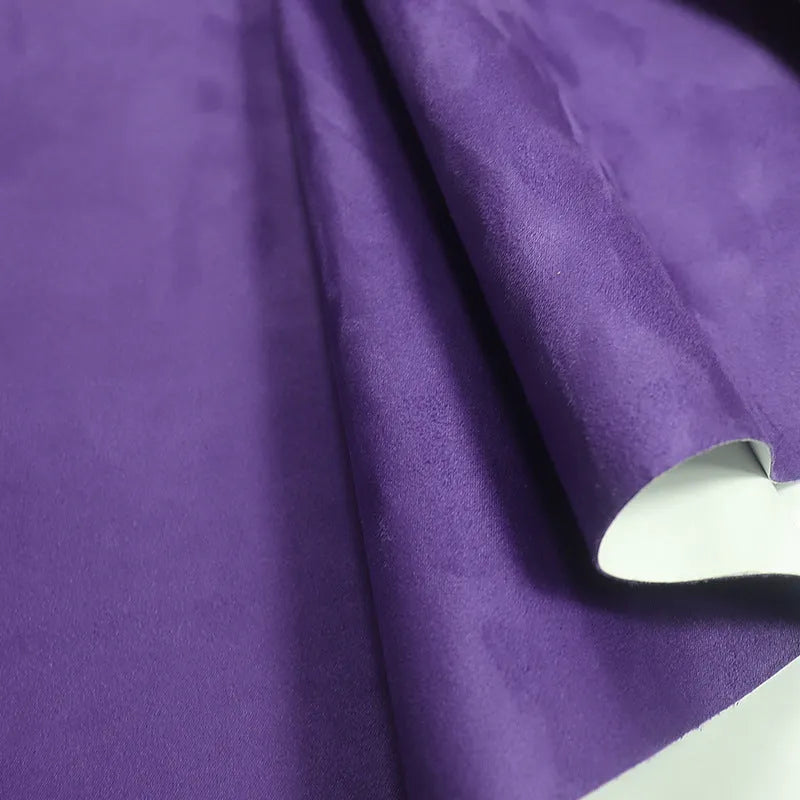 Rolls and sheets of coloured self-adhesive suede leather material for DIY projects.