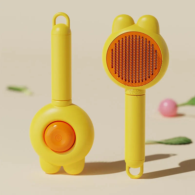 Self-cleaning pet grooming brush with green handle and stainless steel comb, showing the release button.