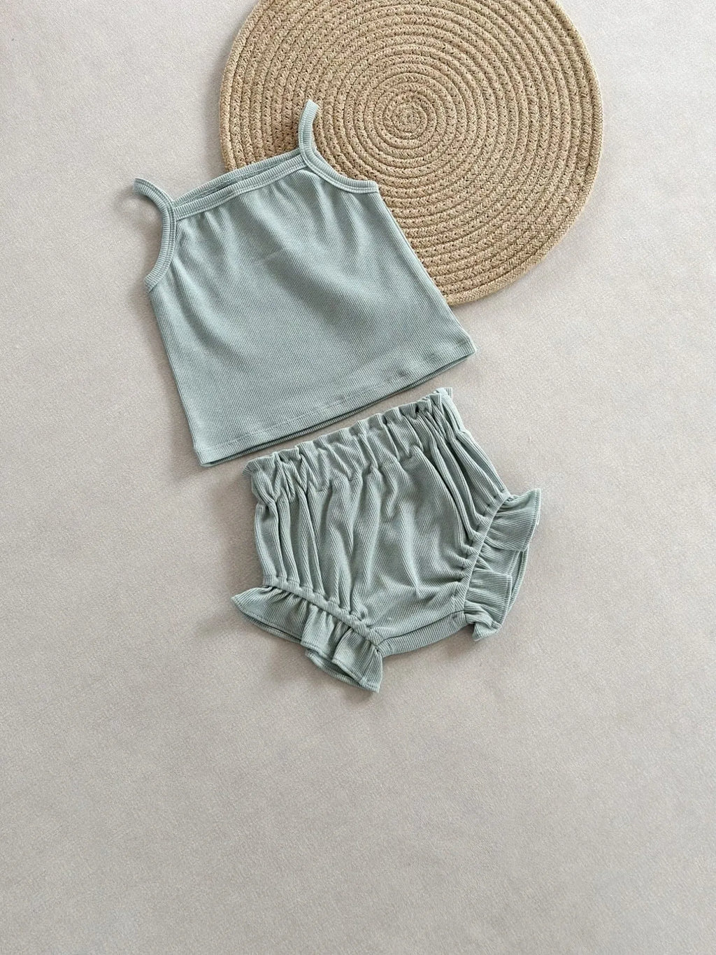 Women's cotton rib home wear two-piece set with sleeveless top and shorts in rose colour on white background