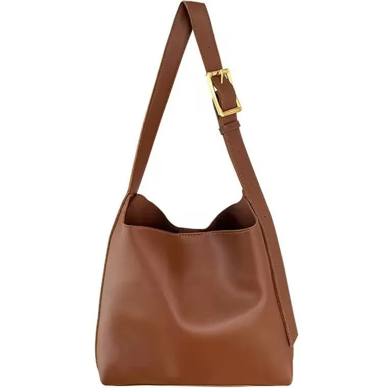 Women's soft PU shoulder bag with swing threads in black or brown colour options