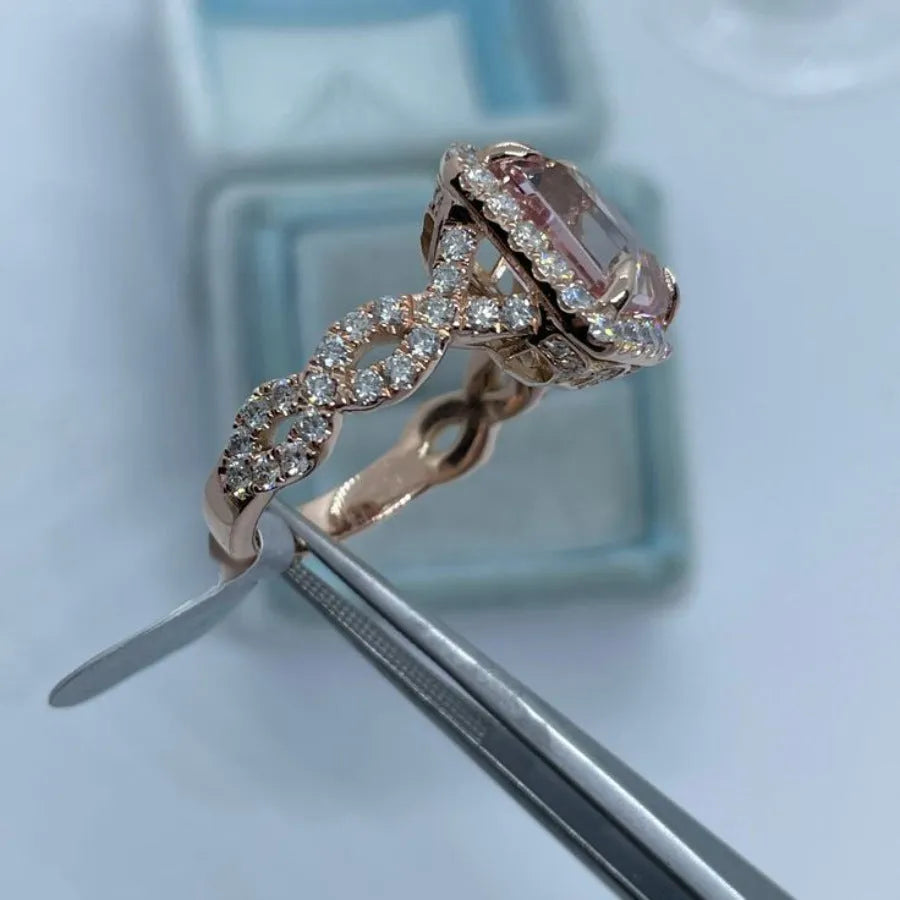 Rose gold electroplated alloy ring with geometric shape on white background