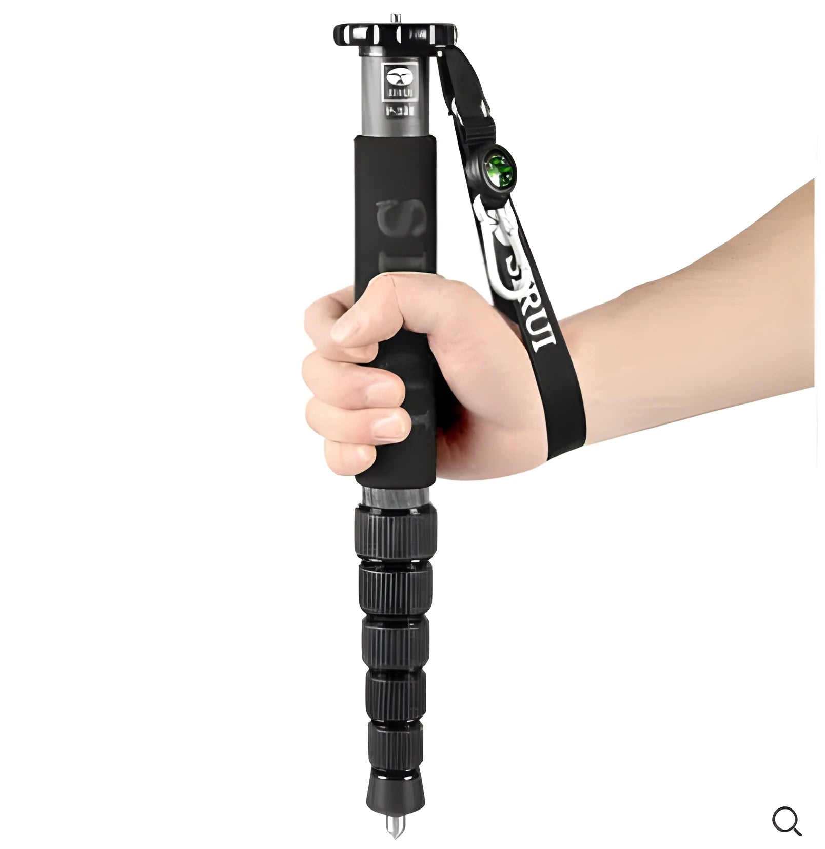 Black carbon fibre monopod for DSLR cameras extended to full height with camera mount visible