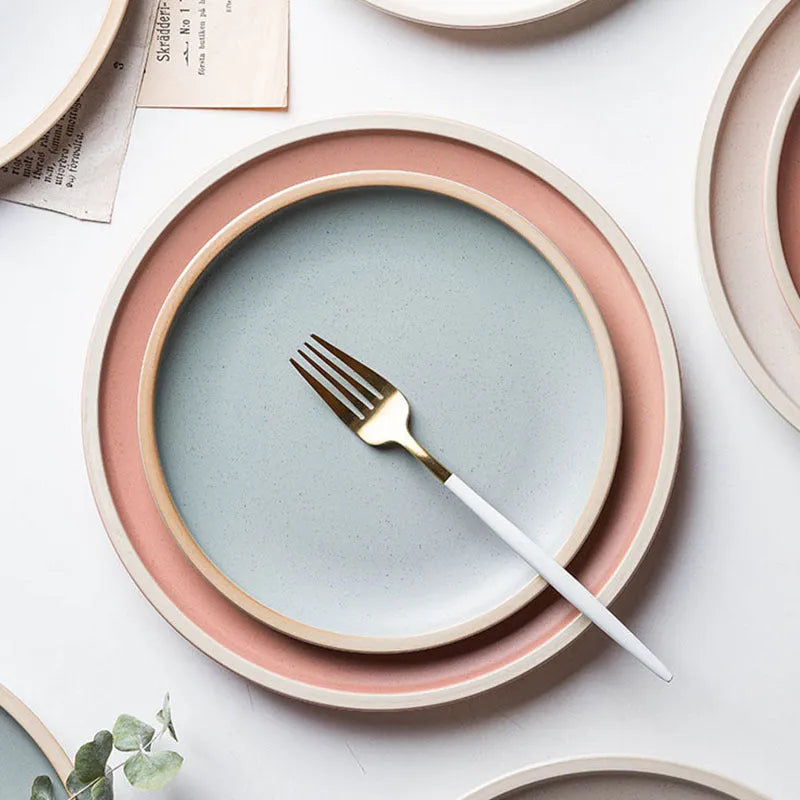 Blue matte ceramic dinner plate 10 inches with sesame point glaze on a table
