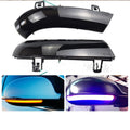 Volkswagen Golf MK5 front end with dynamic sequential amber and blue turn signal lights illuminated.