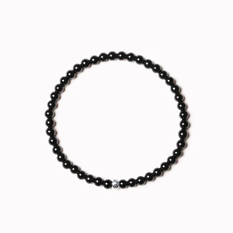Geometric agate bracelet with obsidian, blue San, and black agate stones on wrist