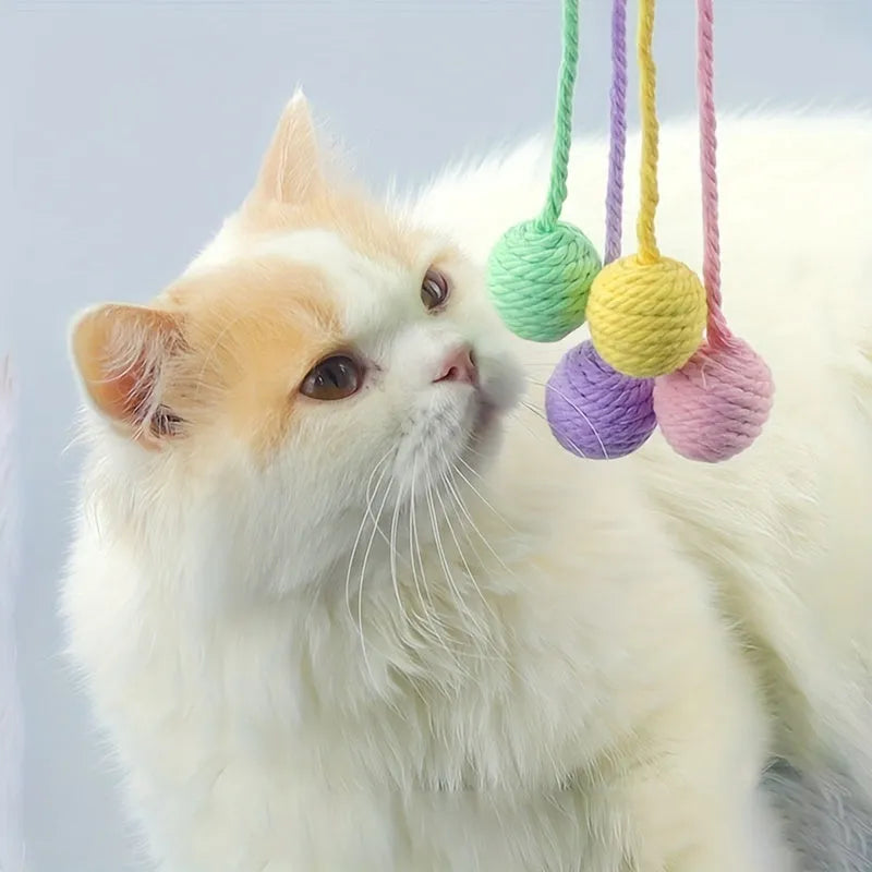 Cat toy ball with rope in four colours: green, pink, purple, and yellow