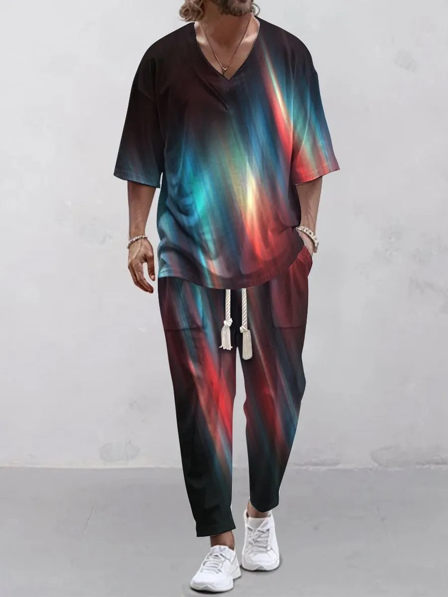 Thin polyester fibre co-ordinated suit with V-neck top, cropped sleeves, and matching trousers on a hanger.