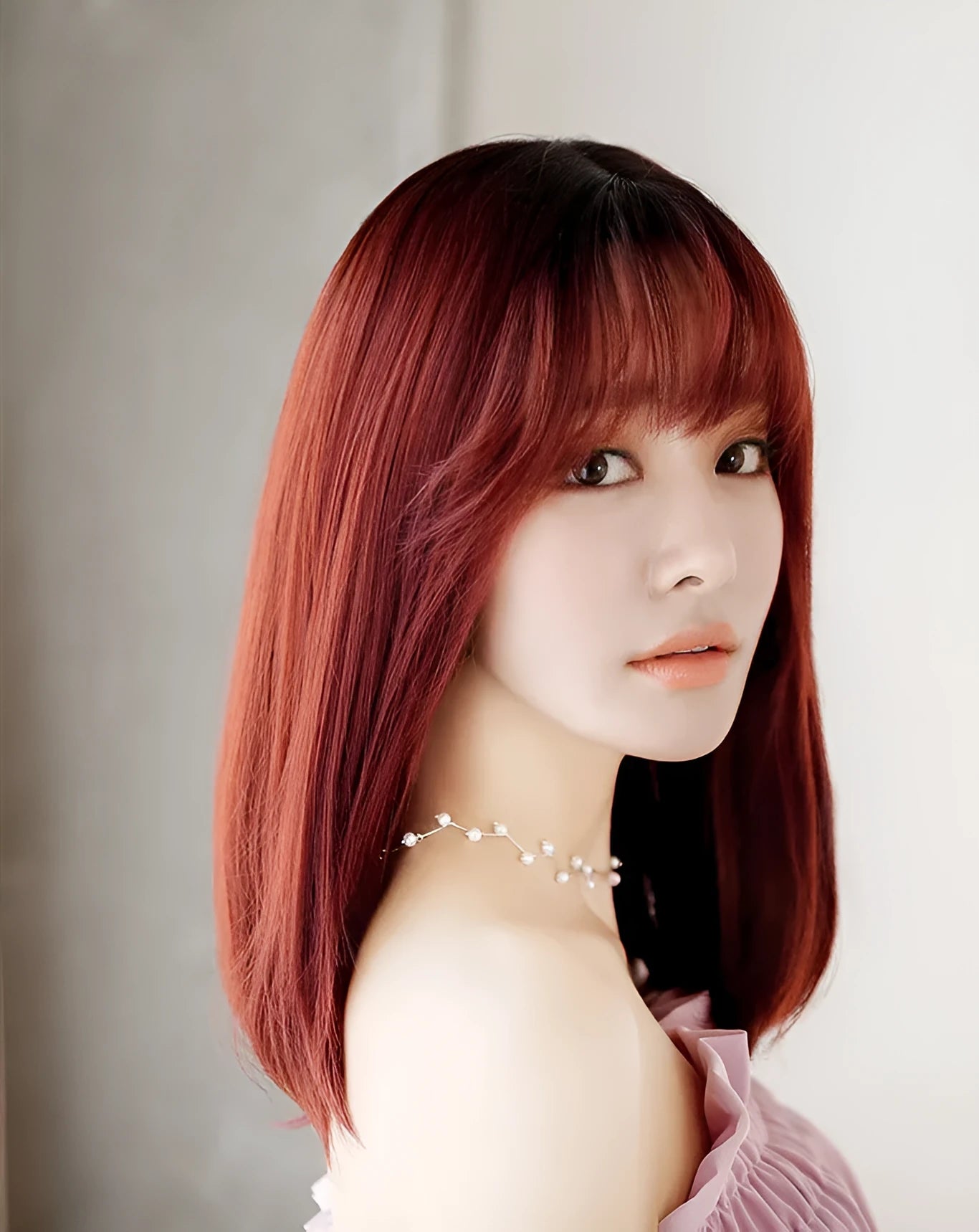 Women's 45cm long straight chemical fibre wig with buckle in honey pudding colour on mannequin head
