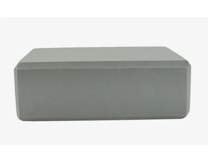 Pure colour EVA yoga brick, thick non-slip mat, and cotton tension band on a floor, in blue, purple, pink, red, black, gray