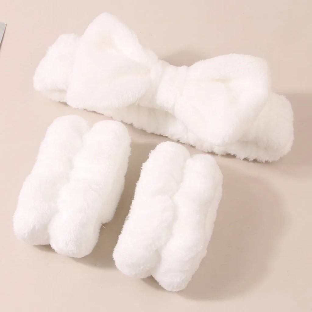 Facial brush keep dry three-piece set showing coral fleece hair band, facial brush with nylon bristles, and storage pouch