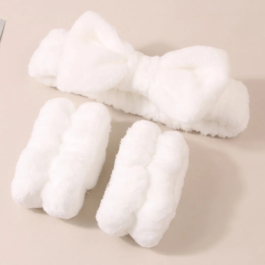 Facial brush keep dry three-piece set showing coral fleece hair band, facial brush with nylon bristles, and storage pouch