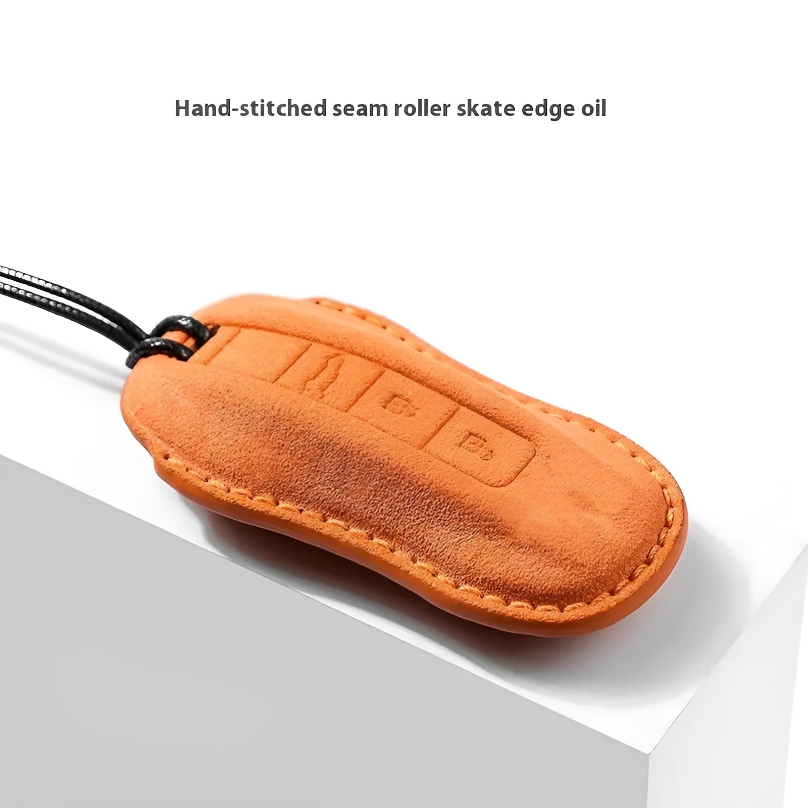 Suede car key cover in cement grey, dark green, light grey, and orange colour options.