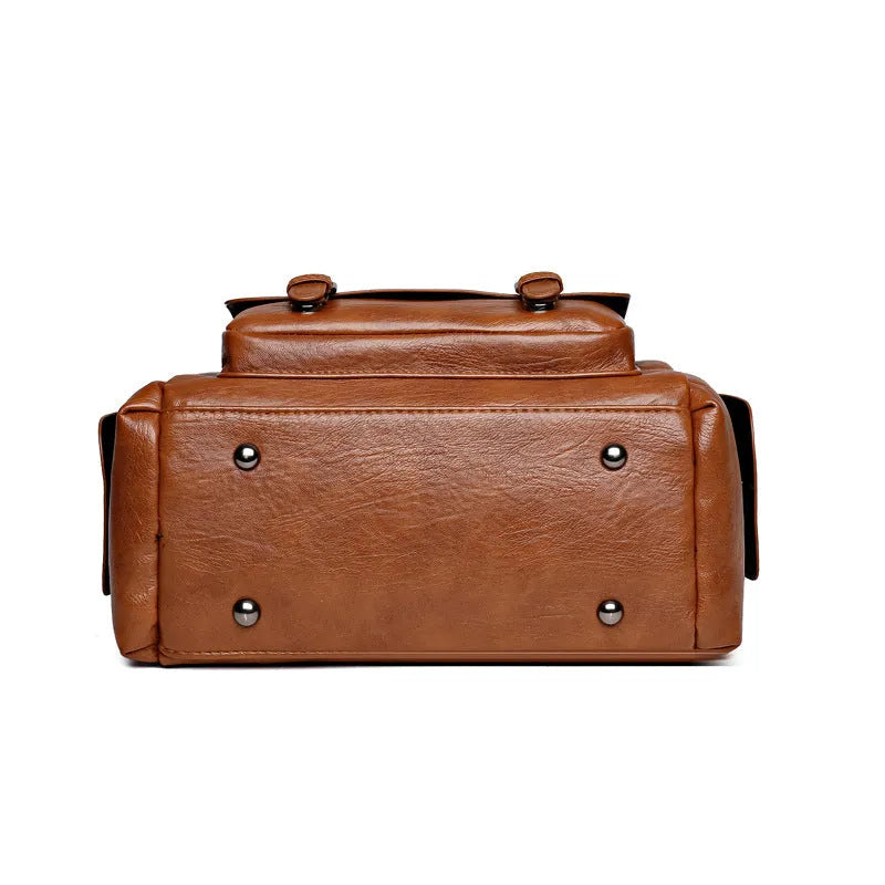 Vintage messenger bag in horizontal square shape with contrast stitching, available in multiple colours