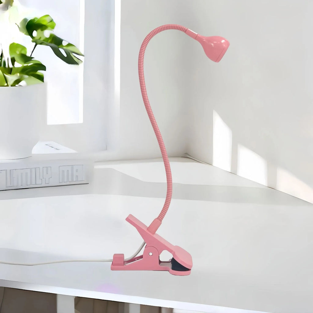 Goose neck nail lamp with USB clip, 395nm purple light curing UV glue on nails in a home manicure setting.