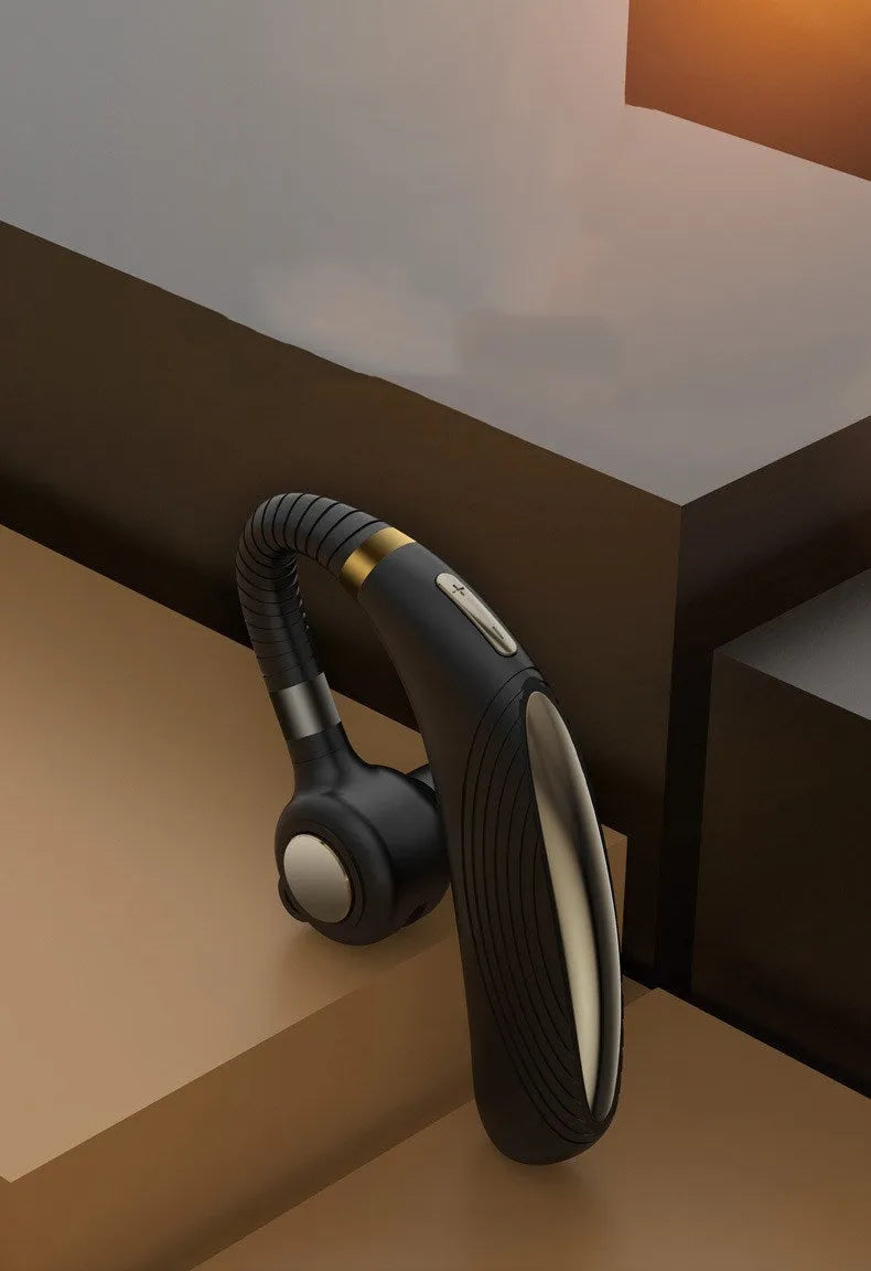 Wireless hanging ear business Bluetooth headset in black with charging port visible