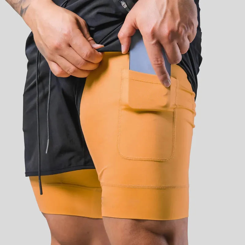 Men's double layer running shorts in light slate green and black, with built-in lining and mid-rise waist for fitness use