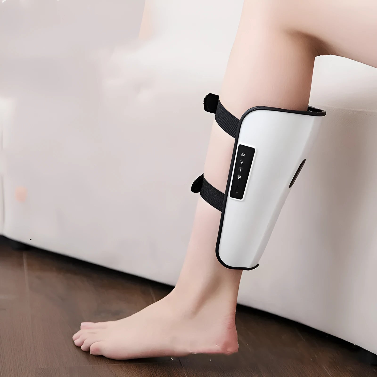 White plastic leg massager with USB Type-C connection for calf acupoint massage with infrared physiotherapy