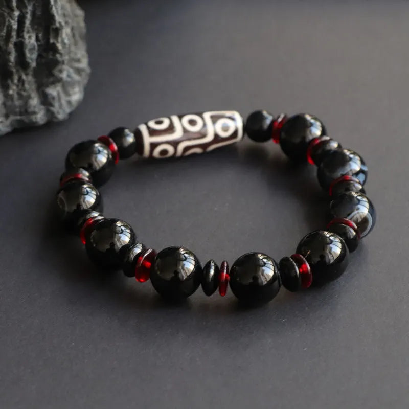 Black agate dzi bead bracelet with chalcedony stones in geometric design