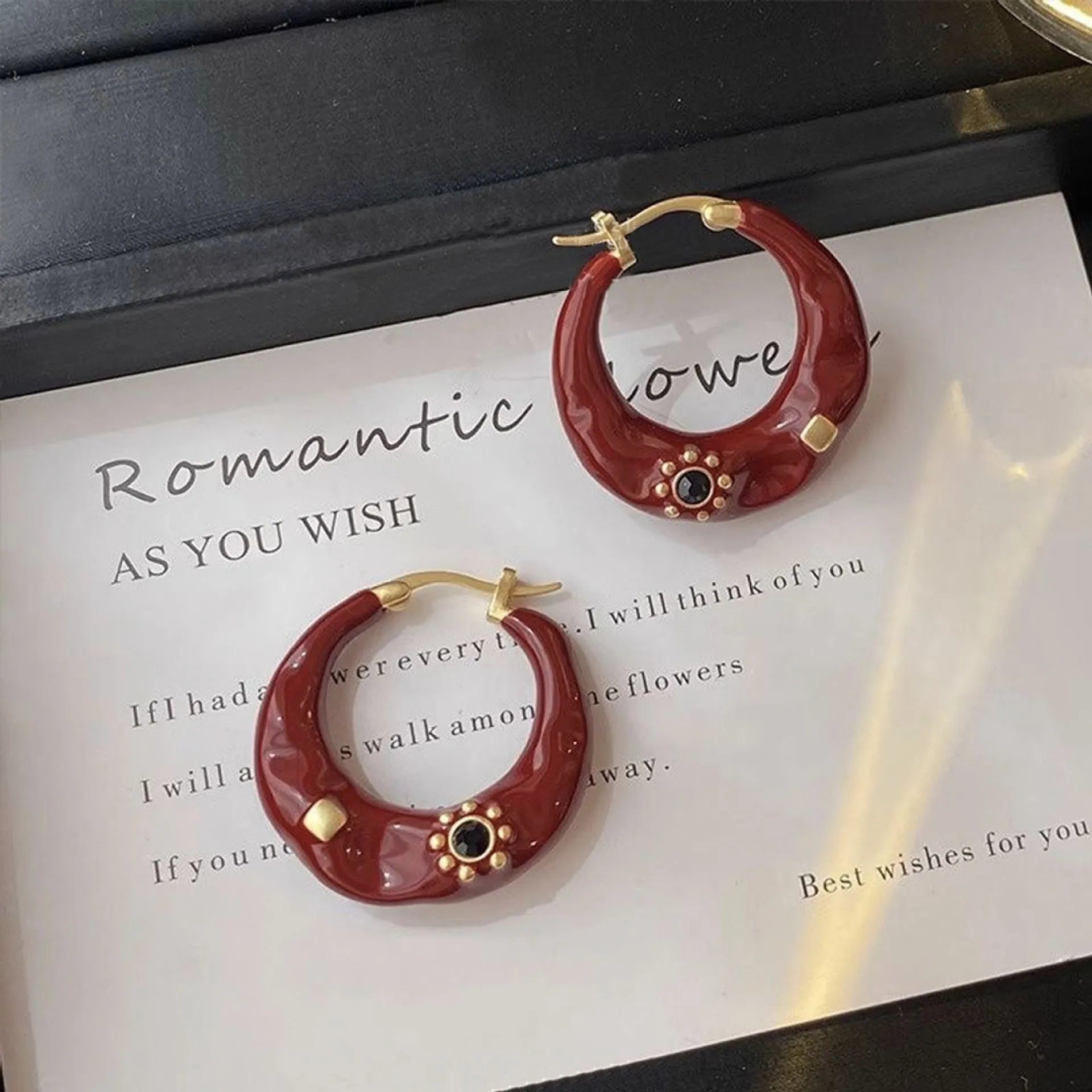 Hong Kong style retro ear studs with rhinestone decoration and dripping oil finish in black and red colour options