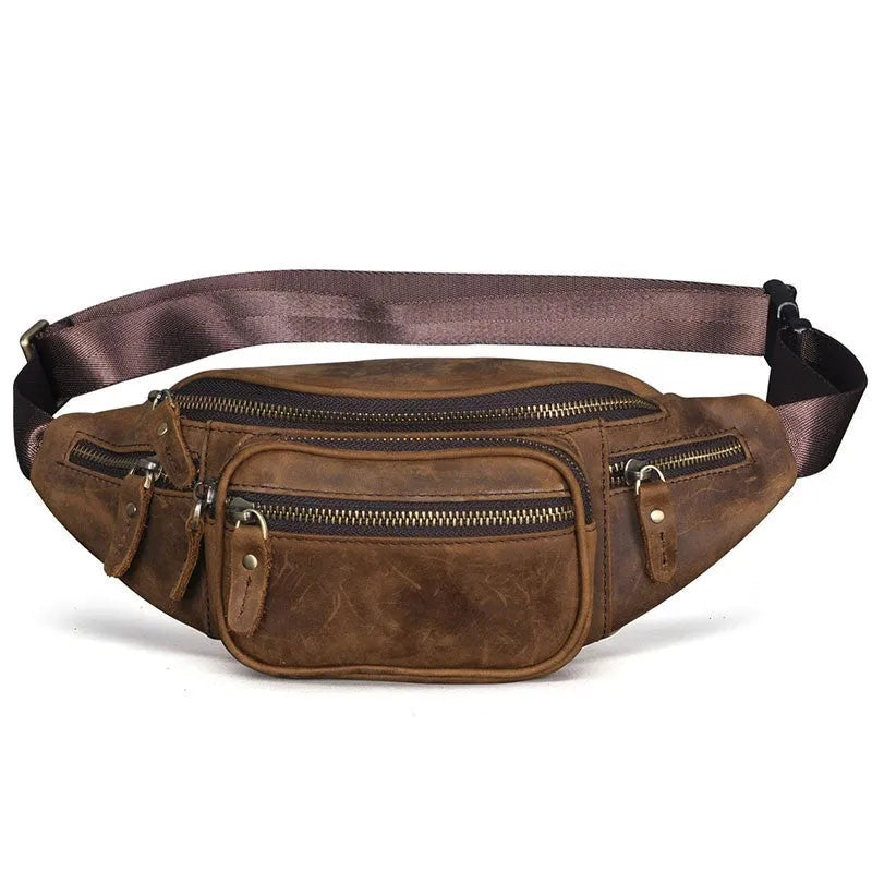 Brown leather shoulder messenger bag with a single strap and magnetic buckle closure.