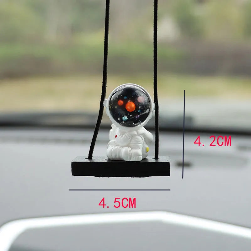 Resin cartoon astronaut car pendant decoration hanging from a rear-view mirror.