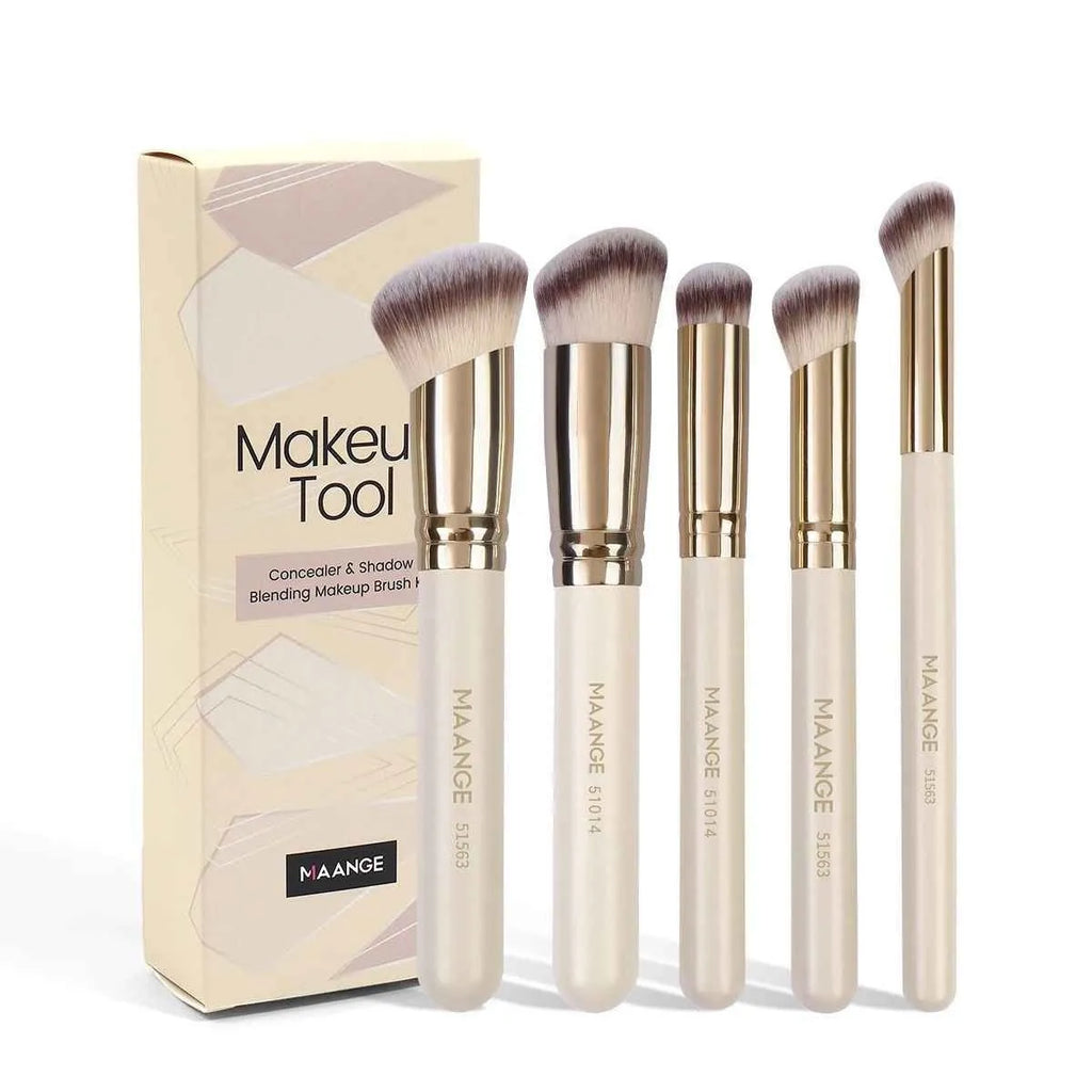 Angled apricot blusher brush and four other synthetic makeup brushes on a white surface.