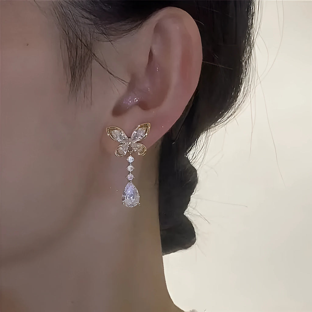 Silver-tone bow stud earrings with electroplated finish on zinc alloy