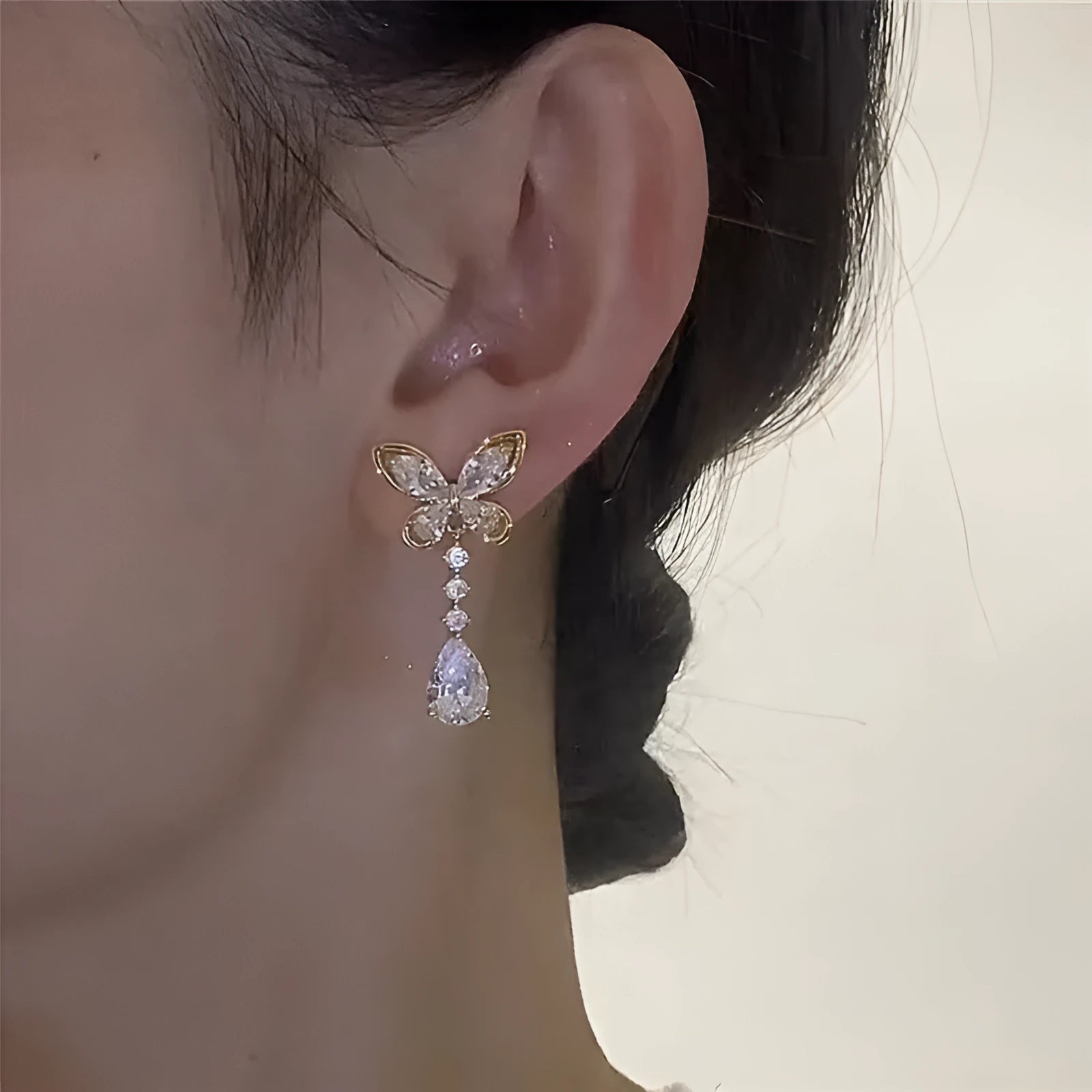 Silver-tone bow stud earrings with electroplated finish on zinc alloy
