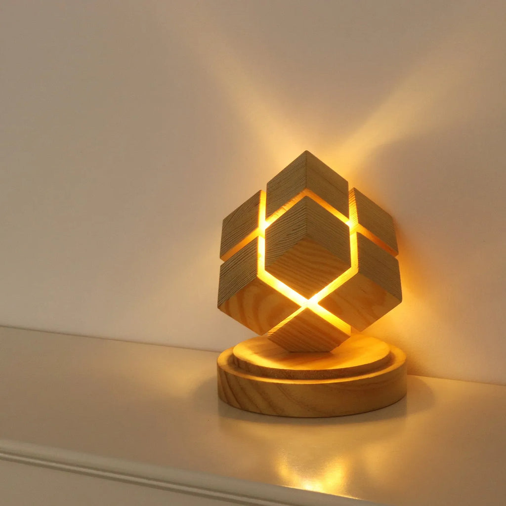 Creative fourth-order Rubik's Cube geometric stereo night lamp with rubber wood shade on bedside table