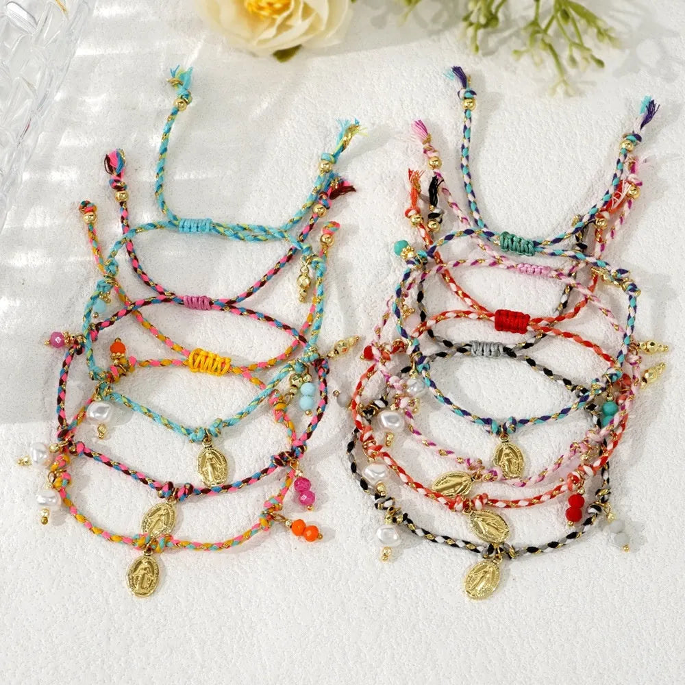 Hand-woven women's bracelet made from colourful braided rope with an integrated carrying strap tag design.