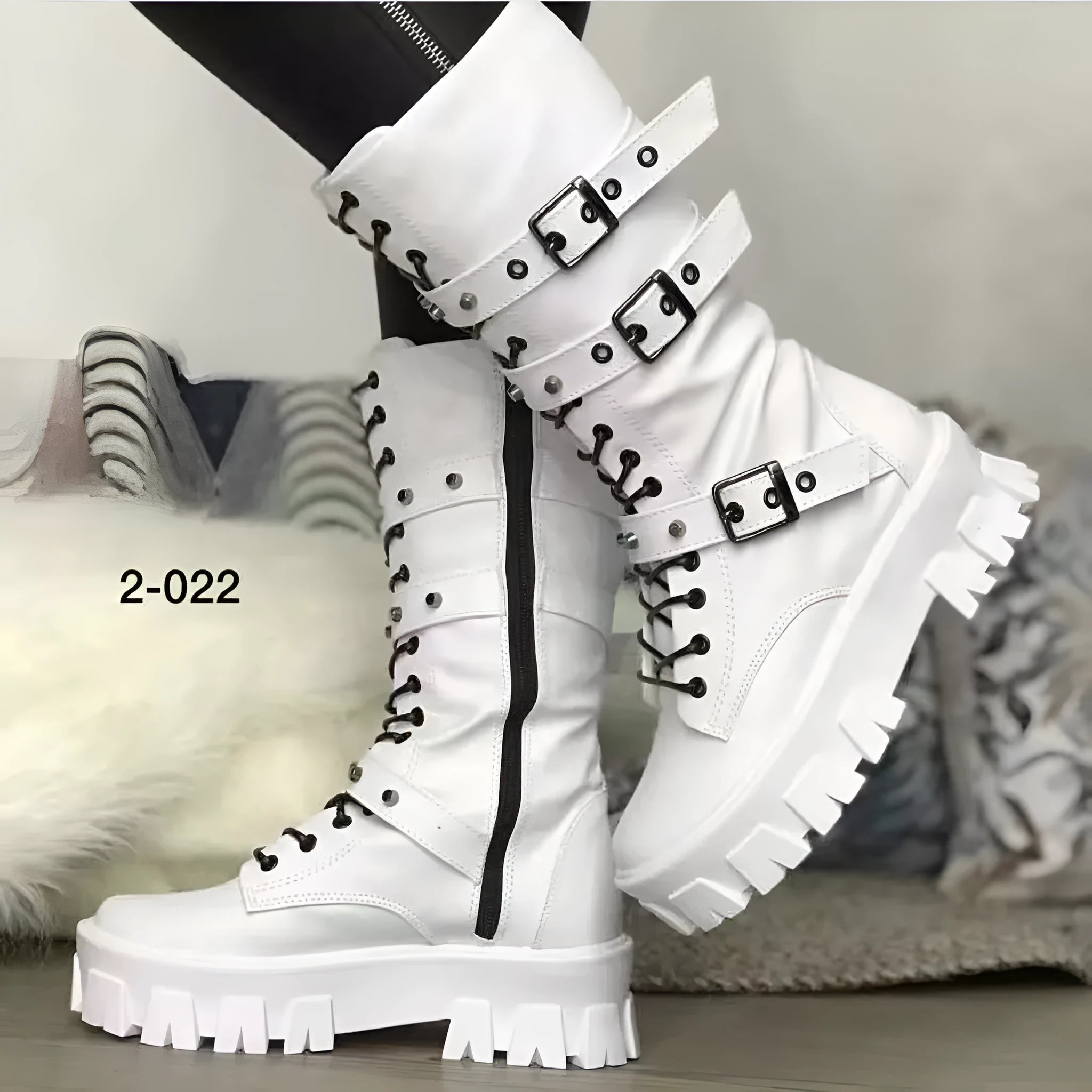 Women's black mid-calf knight boots with metal buckle detailing and side zipper closure