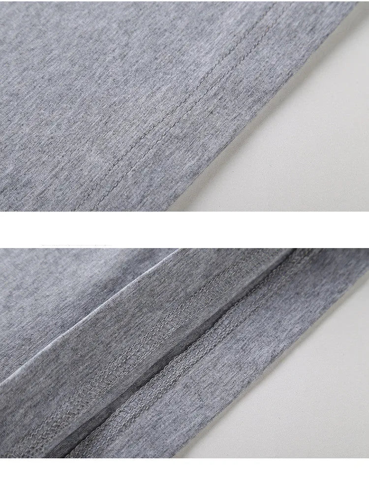 Young men's solid colour linen base shirt in black, sleeveless with striped pattern, worn as casual vest layering piece