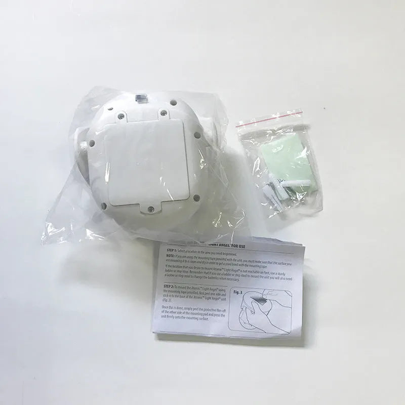 White Atomic Angel induction light with ABS plastic housing measuring 13.3cm wide