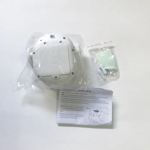 White Atomic Angel induction light with ABS plastic housing measuring 13.3cm wide