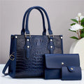 PU leather three-piece bag set showing bucket crossbody bag, wallet and card holder with contrast trim in burgundy colour