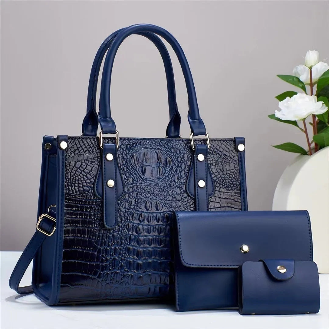 PU leather three-piece bag set showing bucket crossbody bag, wallet and card holder with contrast trim in burgundy colour