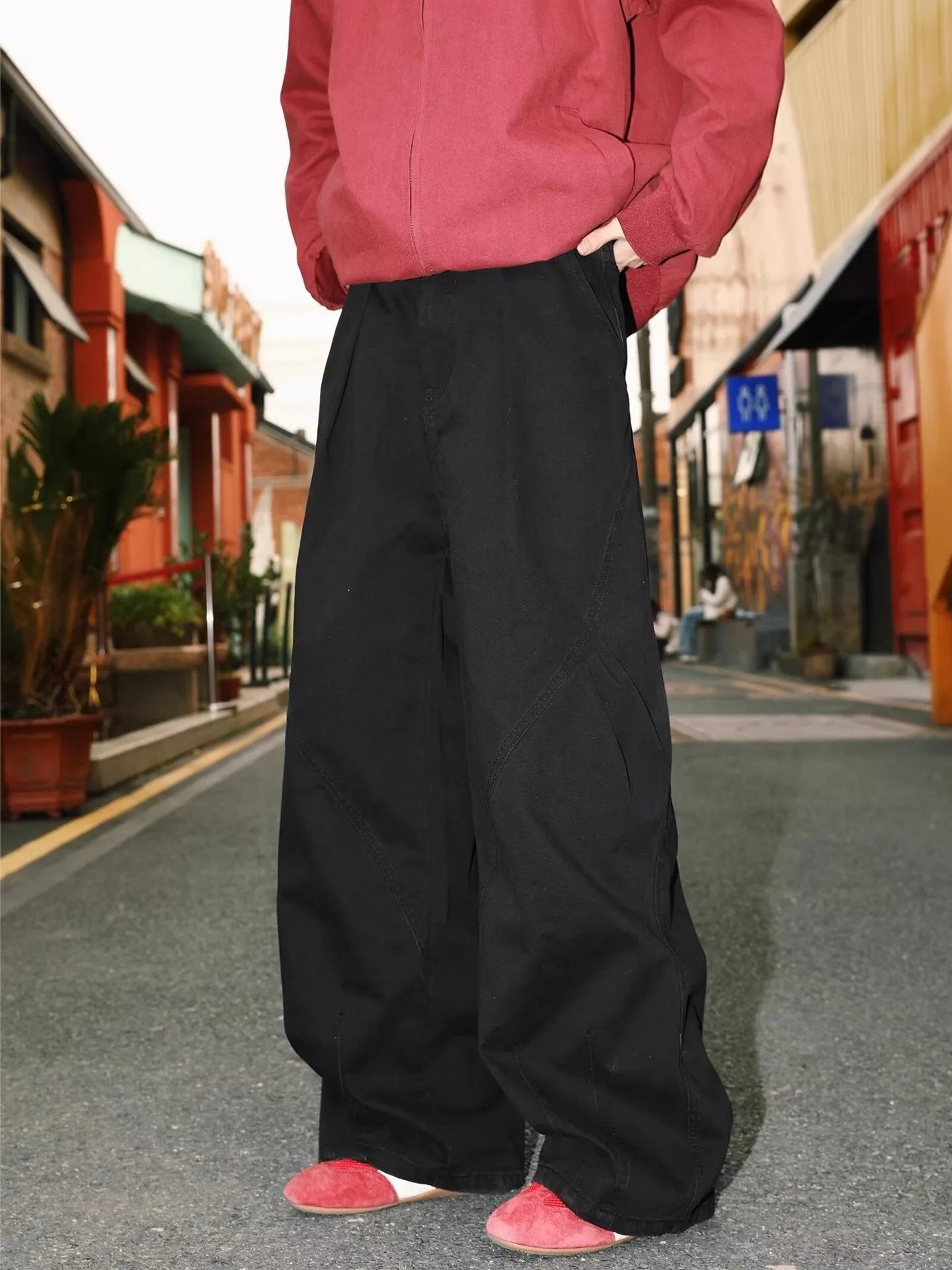 Men's pleated straight-leg trousers in apricot colour on a hanger
