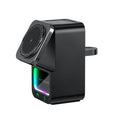 White and black Bluetooth speaker wireless charger with phone mounted magnetically.